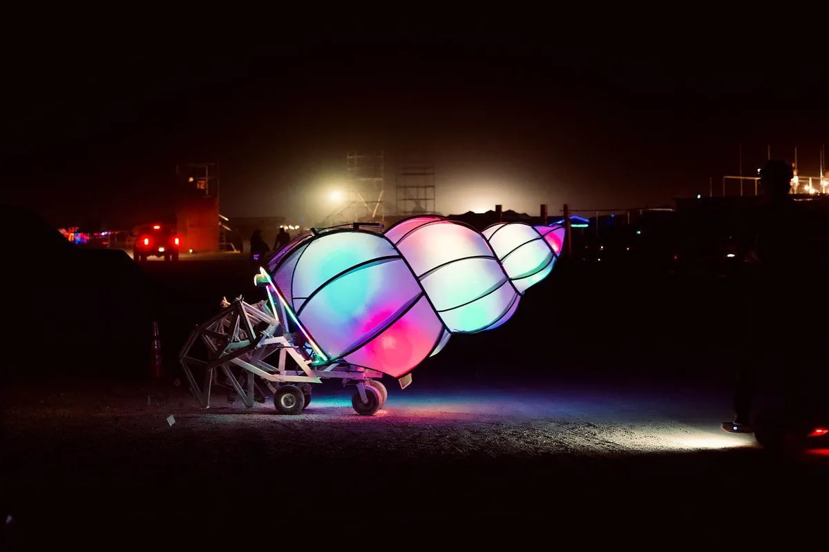 Shelly the Crab glows pink, blue, and green at night